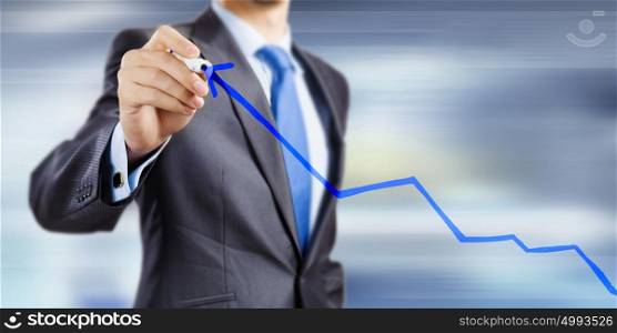 Growth concept. Close up of businessman drawing increasing graph with marker
