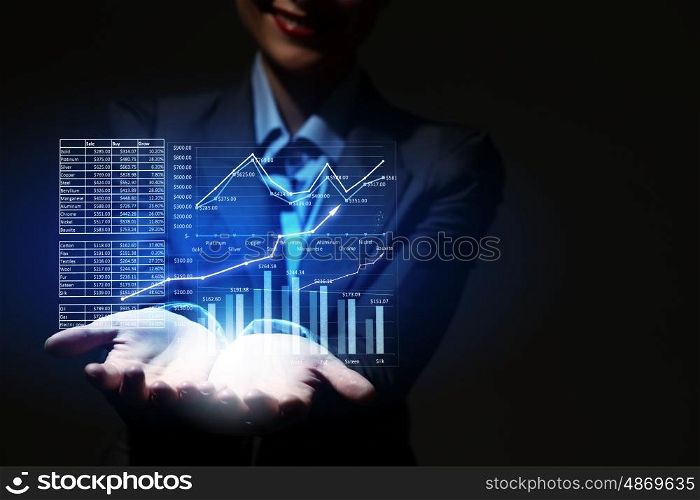 Growth concept. Close up of businesswoman hand presenting digital charts