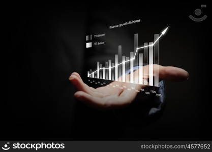 Growth concept. Close up of businesswoman holding graphs in hand