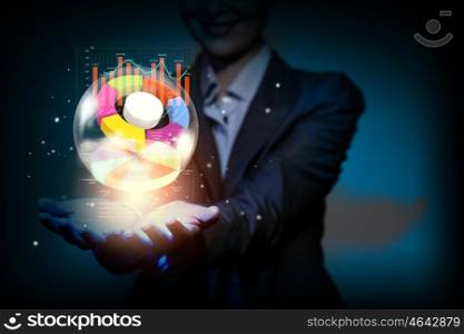Growth concept. Close up of businesswoman holding graphs in hand