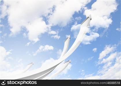 Growth concept image. Abstract image with white arrows going up into sky