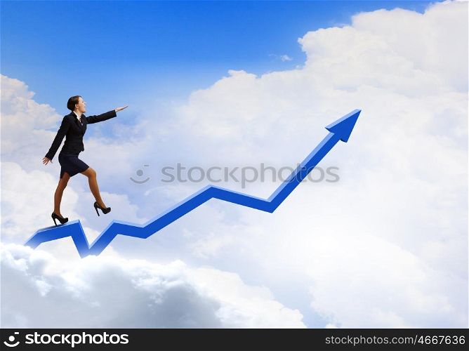 Growth concept. Young cheerful businesswoman walking on increasing graph