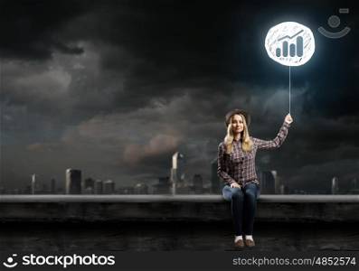 Growth concept. Young woman holding balloon with growth symbol