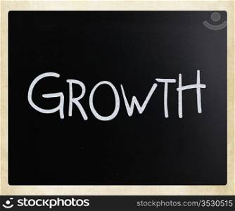 ""Growth" handwritten with white chalk on a blackboard."
