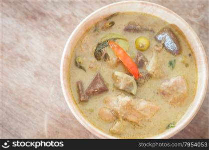 Grren curry in wooden bowl, stock photo