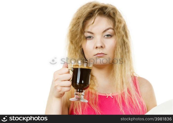 Grumpy tired woman holding black coffee about to drink. Hard morning, getting energy.. Tired woman drinking her morning coffee
