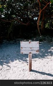 Grung old white wooden sign on the beach at Kabira Bay, Ishigaki, Okinawa Japan.