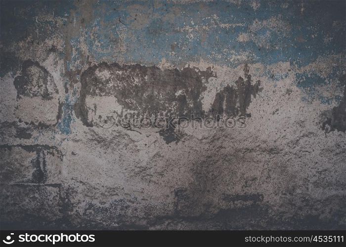 Grunge background of a wall with torn paint