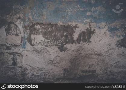 Grunge background of a wall with torn paint