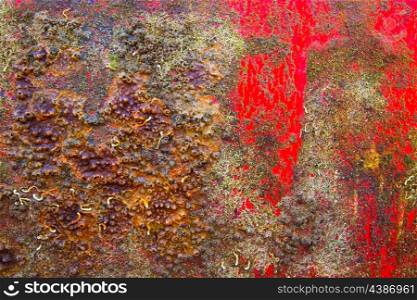 Grunge boat hull background in red and rusty colorful texture