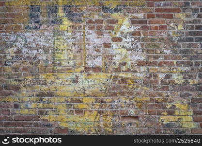 grunge brick wall background texture from old industrial building with the remains of paint