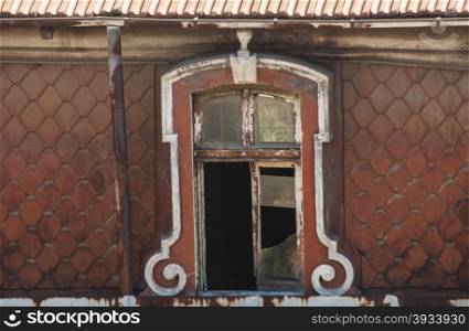 Grunge broken windows of old neglected abandoned vintage building