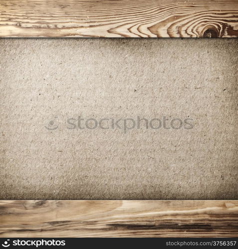 Grunge cardboard background in wood frame with copy space