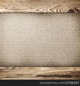 Grunge cardboard background in wood frame with copy space
