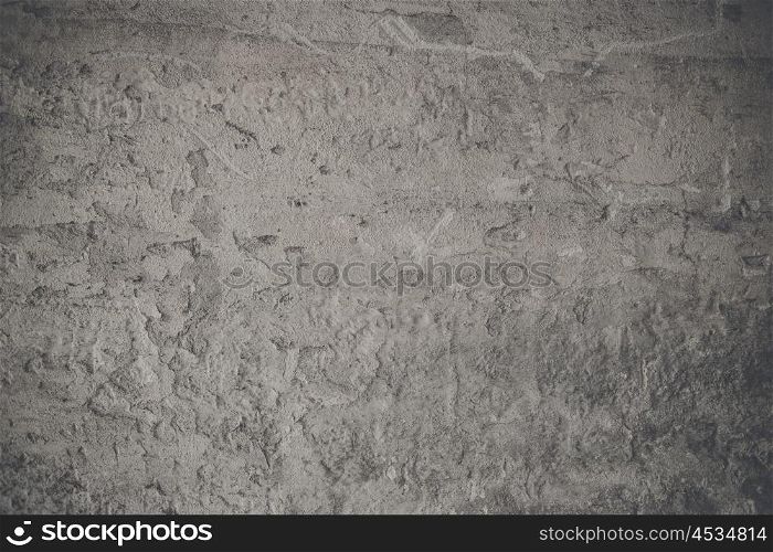 Grunge concrete background with cracks in the wall
