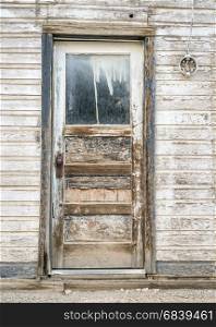 grunge door to an abandoned house in a ghost town in Utah