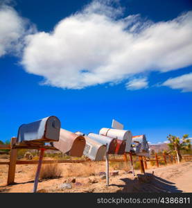 Grunge mail boxes in a row at California Mohave desert USA