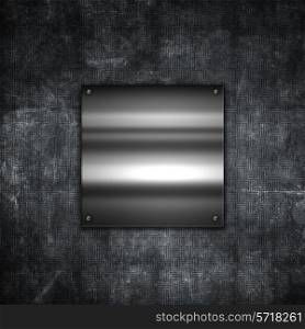 Grunge metal background with a shiny metallic plate