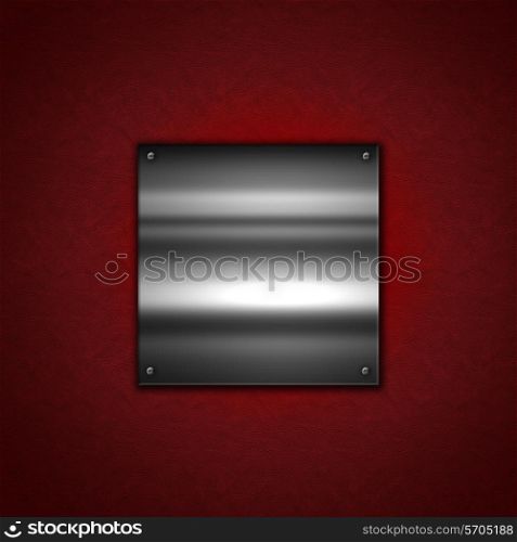 Grunge Metal background with a shiny metallic plate on a red leather texture