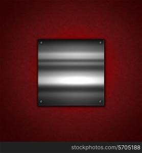 Grunge Metal background with a shiny metallic plate on a red leather texture