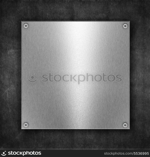 Grunge metal background with shiny metal plate