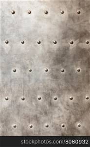 grunge metal plate as background texture. grunge metal plate or armour texture with rivets as background