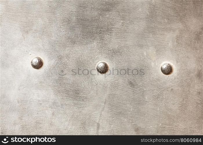 grunge metal plate as background texture. grunge metal plate or armour texture with rivets as background