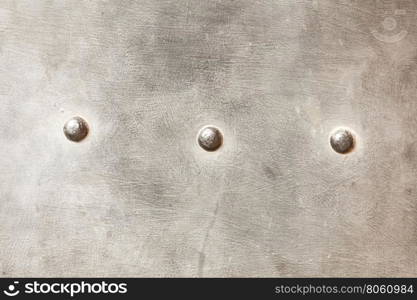 grunge metal plate as background texture. grunge metal plate or armour texture with rivets as background