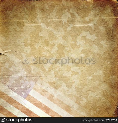 Grunge military background. American flag over desert camouflage pattern. Grunge military background in yellow