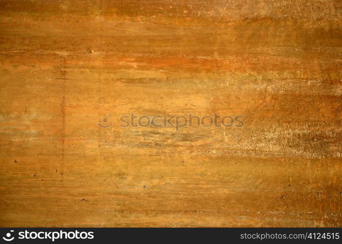 Grunge orange wall texture background in golden colors