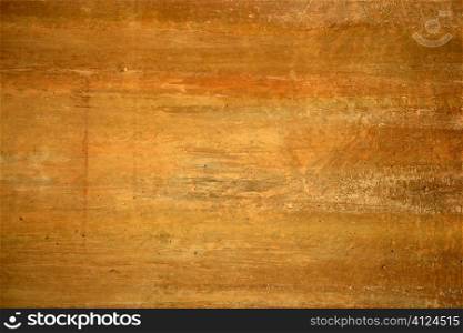 Grunge orange wall texture background in golden colors