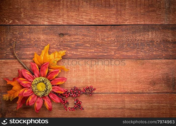 grunge red barn wood background with colorful fall decoration