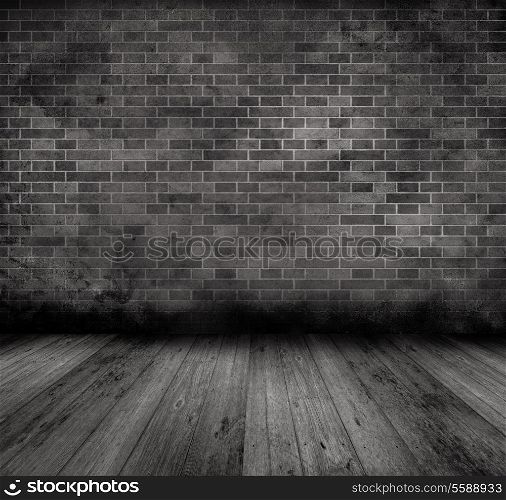 Grunge style image of an old interior with brick wall and wooden floor