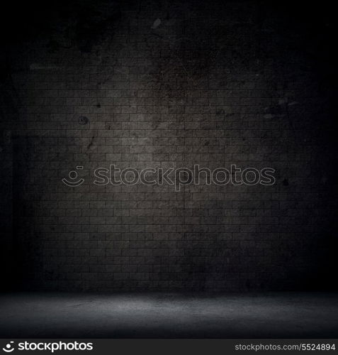 Grunge style interior with brick wall and concrete floor