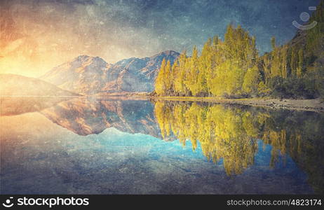 Grunge styled lanscape. Natural beautiful landscape of mountain lake and forest