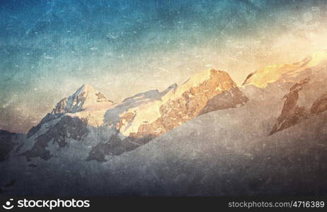Grunge styled lanscape. Natural beautiful landscape of sunrise above mountains