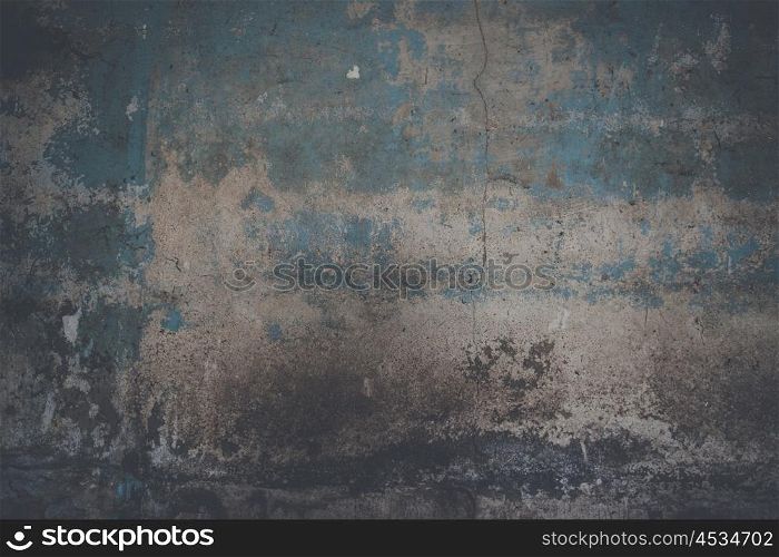 Grunge wall background with weathered paint and crack