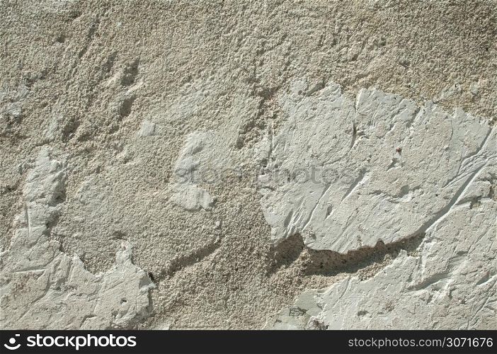 Grunge weathered scratched wall plaster surface as background