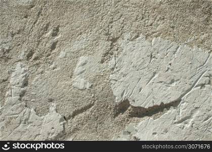 Grunge weathered scratched wall plaster surface as background