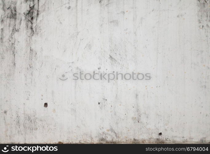 Grunge White Concrete Wall Background. The grunge white concrete old texture wall