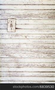 grunge white painted wood wall background with an electric switch