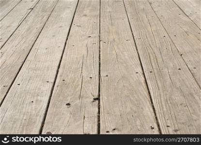 Grunge wooden floor with old nails in it