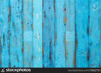 Grungy blue paintwork on a wooden panel