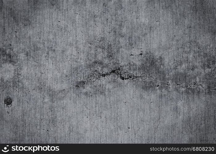 Grungy cracked concrete wall and floor as background texture