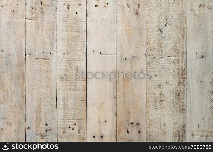 Grungy grey paintwork on a wooden panel