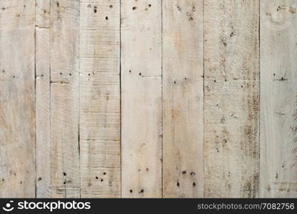 Grungy grey paintwork on a wooden panel