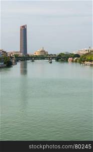 Guadalquivir river Seville Tower Triana bridge Seville Spain.