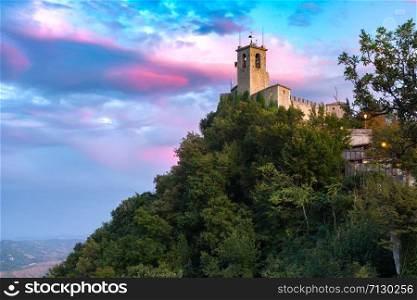 Guaita fortress or Prima Torre on the ridge of Mount Titano, in the city of San Marino of the Republic of San Marino at sunset. Guaita fortress in San Marino