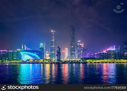 Guangzhou cityscape skyline over the Pearl River illuminated in the evening. Guangzhou, China. Guangzhou skyline. Guangzhou, China