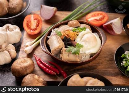 Guay Jap, meatballs, Vietnamese Pork Sausage and a fried egg, Thai food.